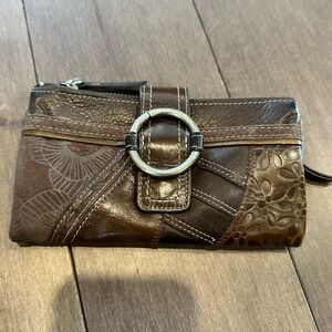 Fossil leather wallet.  Can also be used as a clutch.